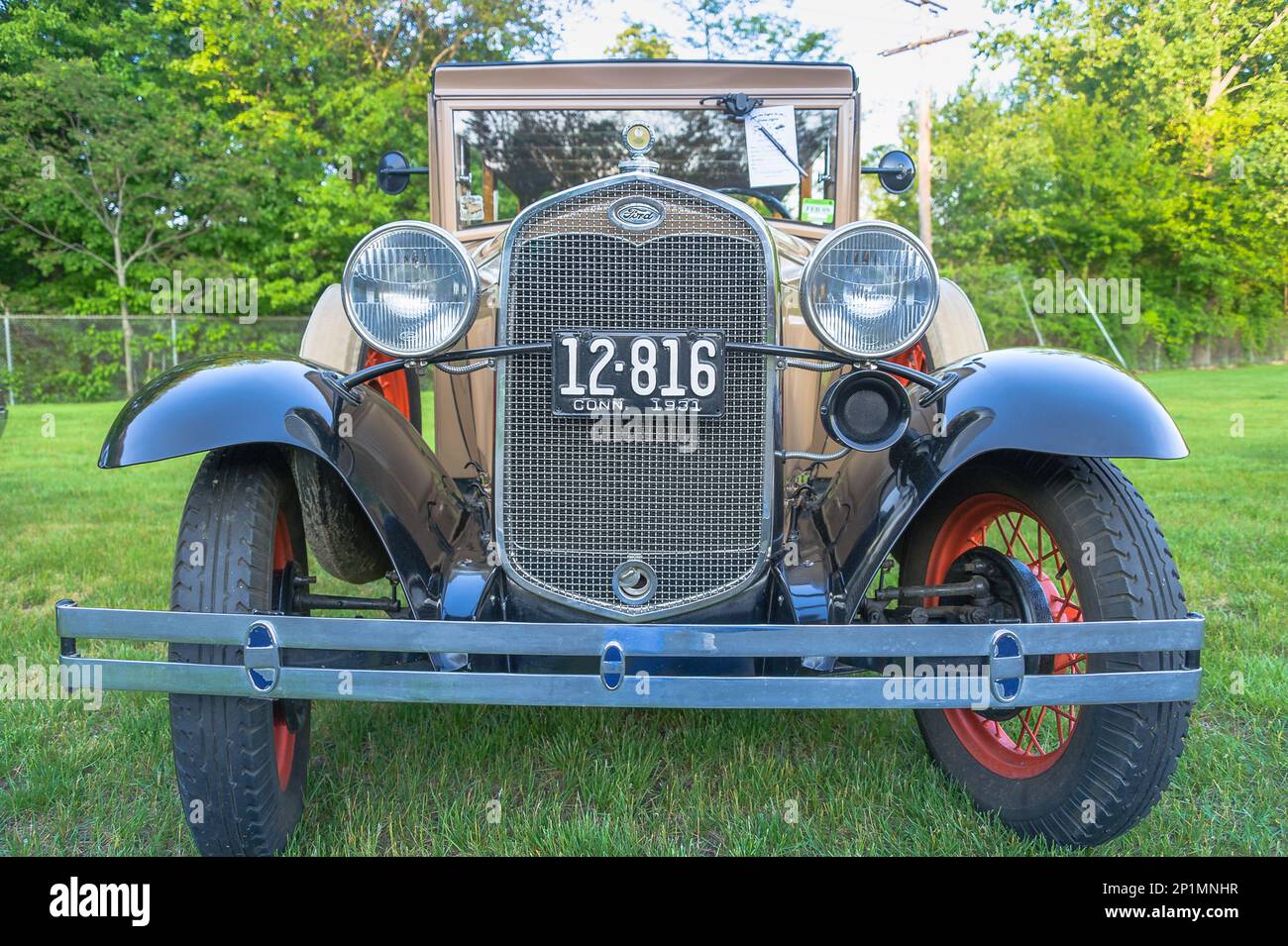 Essex, CT, USA - 24 May 2011: 1931 vintage Ford Model A automobile parked on a quiet New England village green. Stock Photo