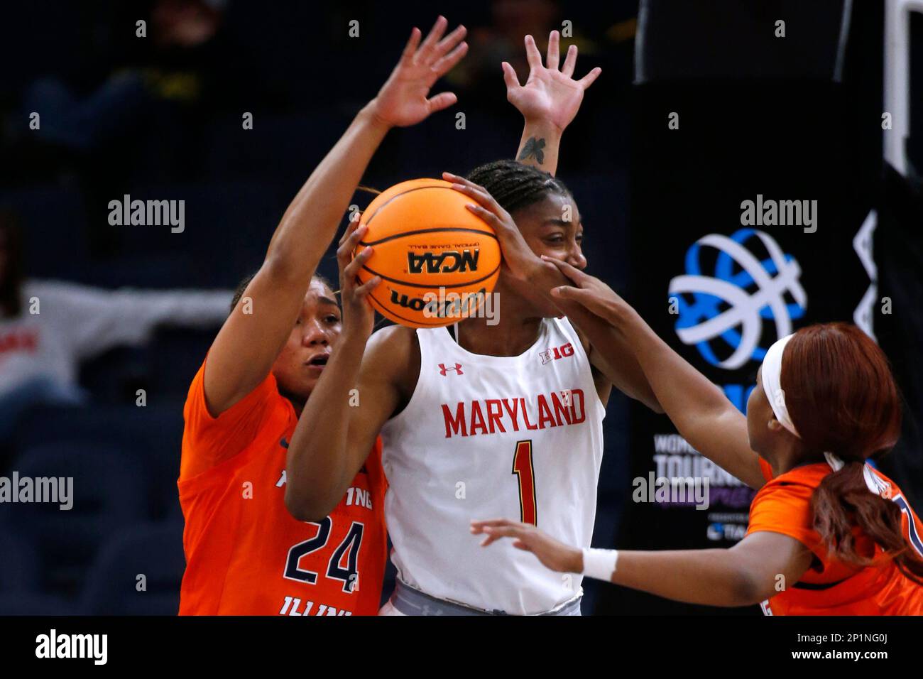 Maryland guard Diamond Miller (1) is defended by Illinois guards Adalia
