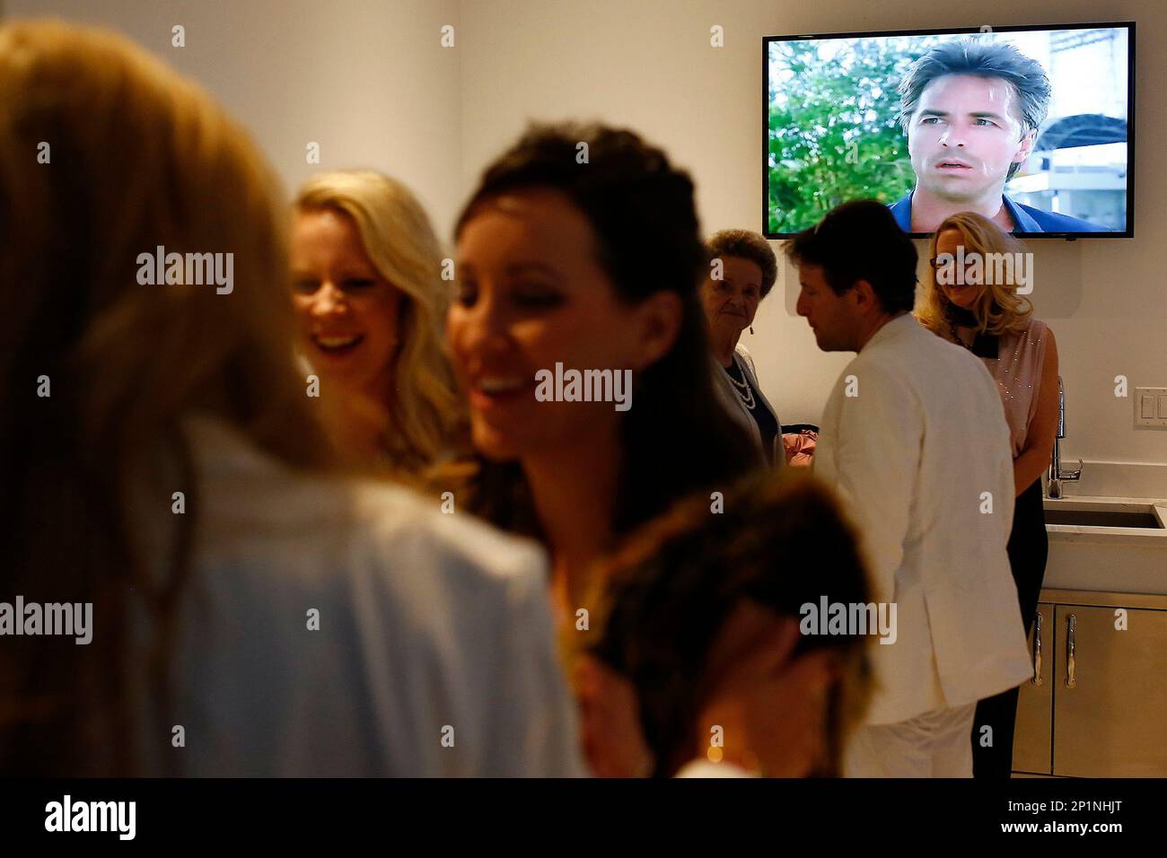 bent frakke Kælder Actor Don Johnson is shown on a TV screen as episodes of Miami Vice play in  the background during a dinner fundraiser party Friday, Feb. 26, 2016 at  the Wilson home in