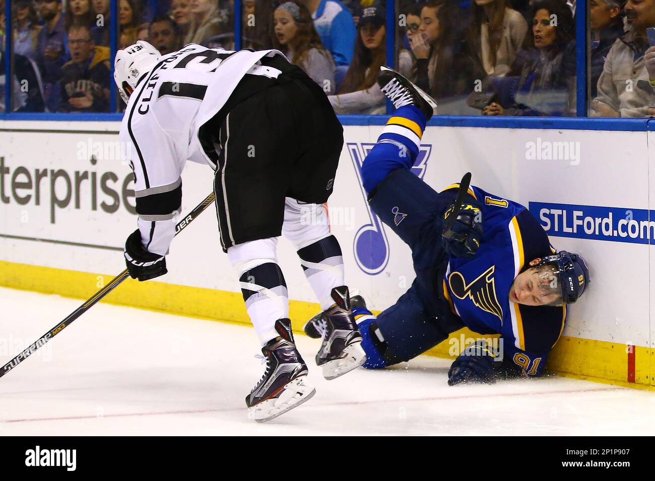 https://c8.alamy.com/comp/2P1P907/february-18-2016-st-louis-mo-st-louis-blues-right-wing-vladimir-tarasenko-91-is-upended-as-he-is-checked-into-th-boards-by-los-angeles-kings-left-wing-kyle-clifford-13-during-the-second-period-of-a-nhl-hockey-game-thursday-feb-18-2016-in-st-louis-mandatory-credit-billy-hurstcsm-cal-sport-media-via-ap-images-2P1P907.jpg