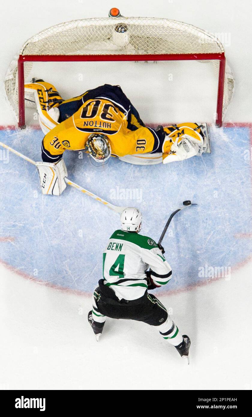 February 15, 2016: Dallas Stars left wing Jamie Benn (14) shoots the puck  on Nashville Predators goalie Carter Hutton (30) during the third period of  an NHL game at Bridgestone Arena in