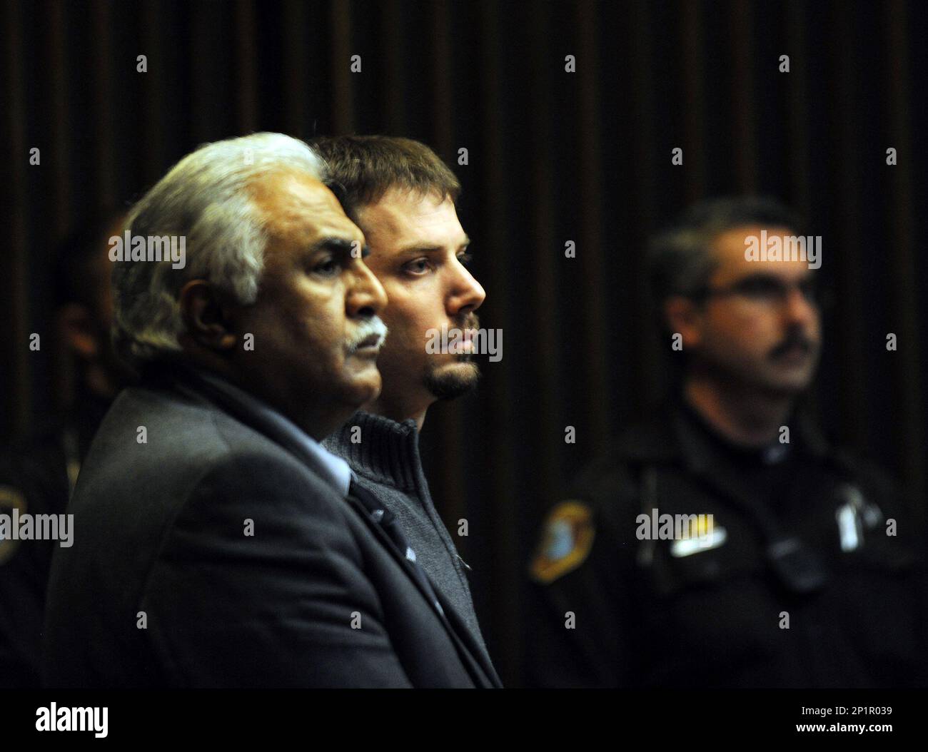Flanked by his attorney Azhar Sheikh, left, and sheriff's deputies ...