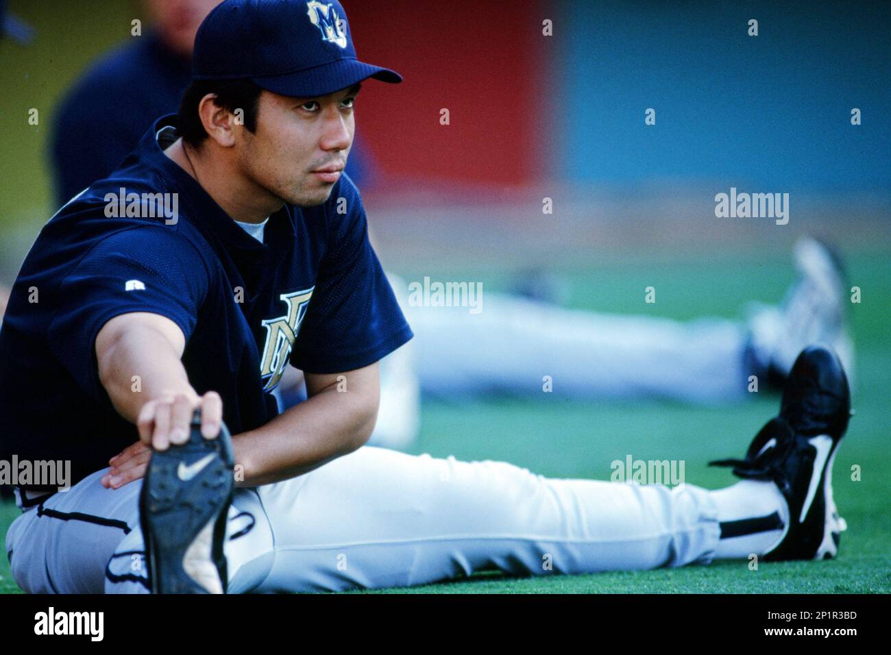Hideo Nomo of the Milwaukee Brewers stretches before a 1999 Major