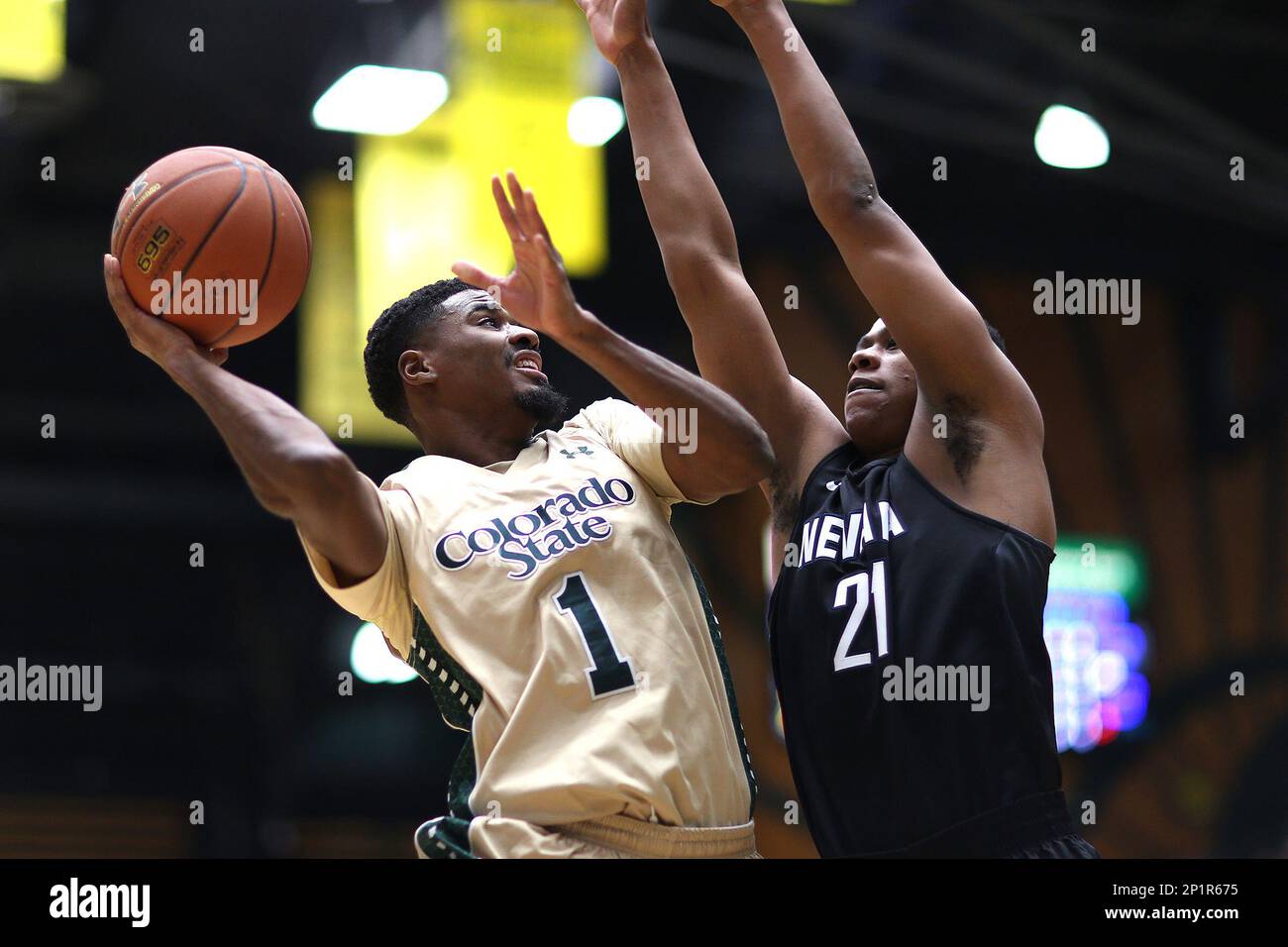 Colorado State guard Antwan Scott drives to the basket against Nevada's Eric Cooper Jr. during