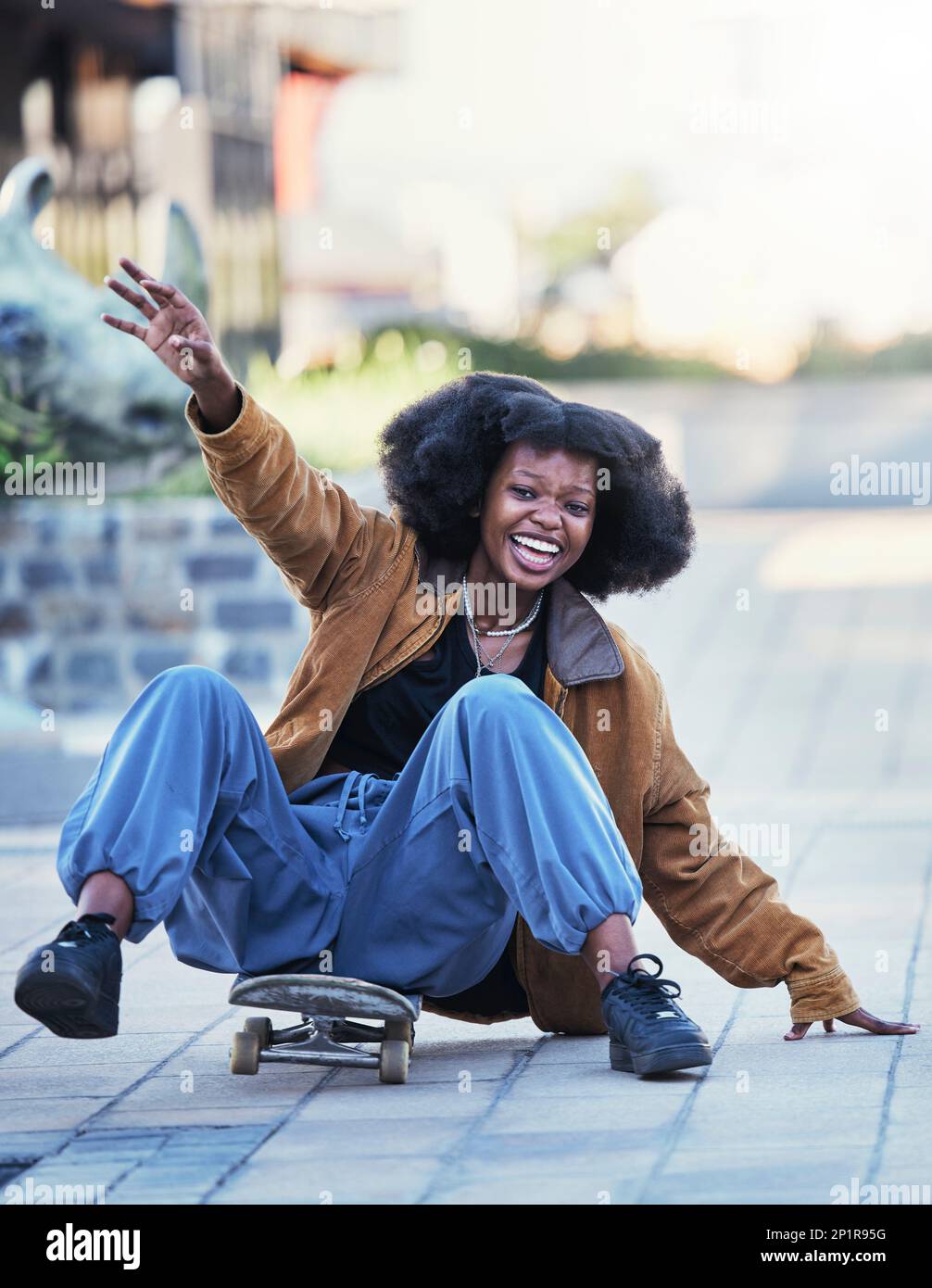 Fitness, skateboard and black woman in city, fun and exercise with