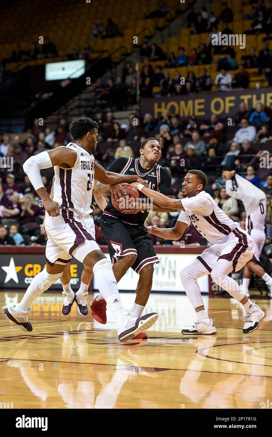 23 January 2016: Arkansas State Red Wolves guard Donte Thomas (24) drives  through Texas State Bobcats defenders during an NCAA basketball game  between the Arkansas State Red Wolves and the Texas State