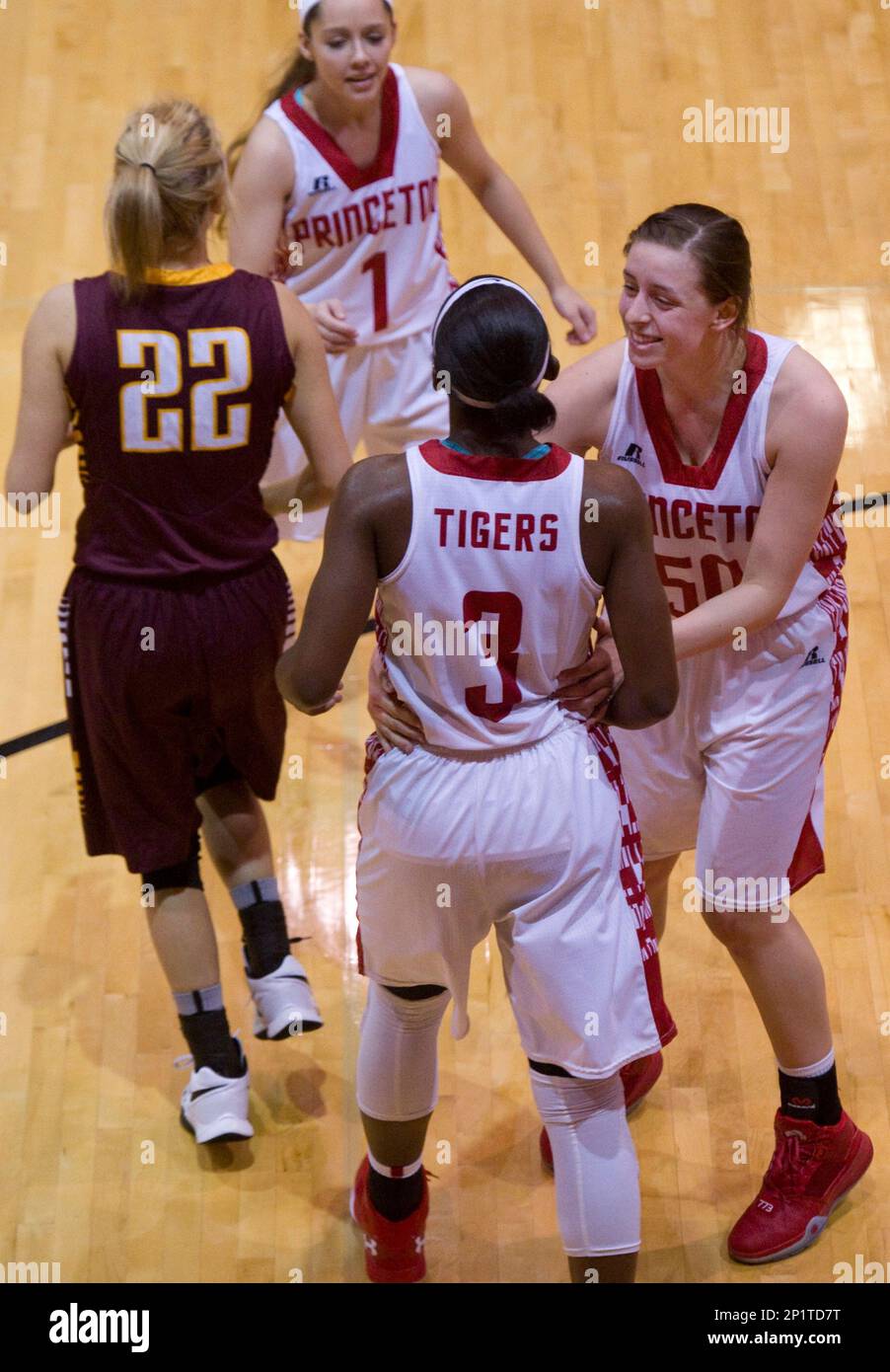 Princeton's Jackie Young (3) is congratulated by teammates Brooke James  (50) and Kaycee Russell (1) after scoring her 3,136th career point against  the Pike Central Chargers at Princeton Community High School Thursday