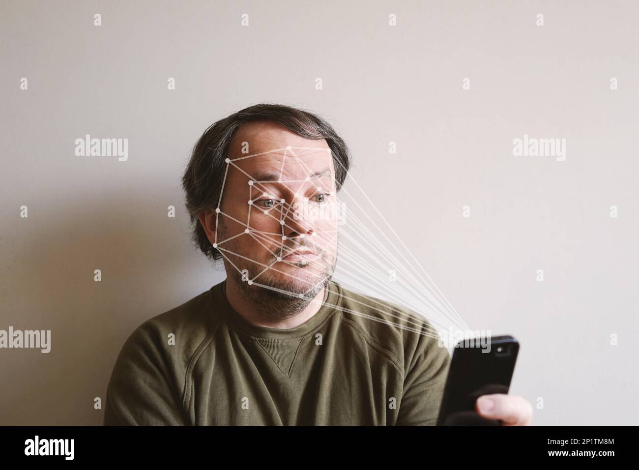 facial recognition by smartphone allows biometric authentication and face expression tracking Stock Photo