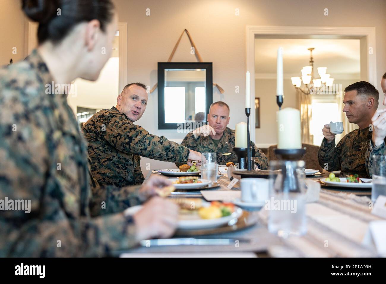 U.S. Marines and Sailors with 2nd Marine Logistics Group conversate