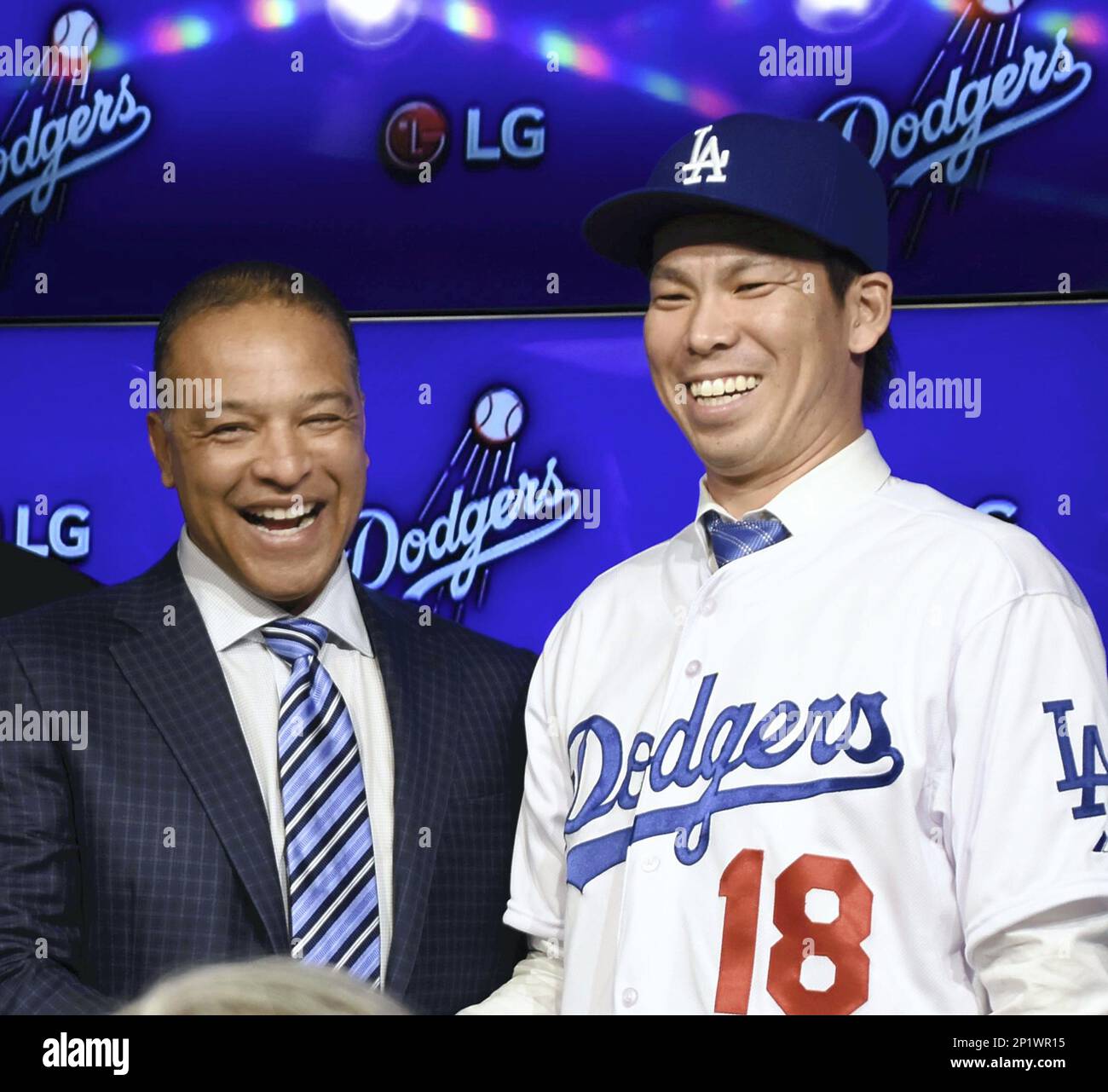Japanese right-hand pitcher Kenta Maeda, wearing No. 18, speaks during his  introductory press conference at Dodger Stadium in Los Angenles on Jan. 7,  2016. The former Hiroshima Carp ace made the official