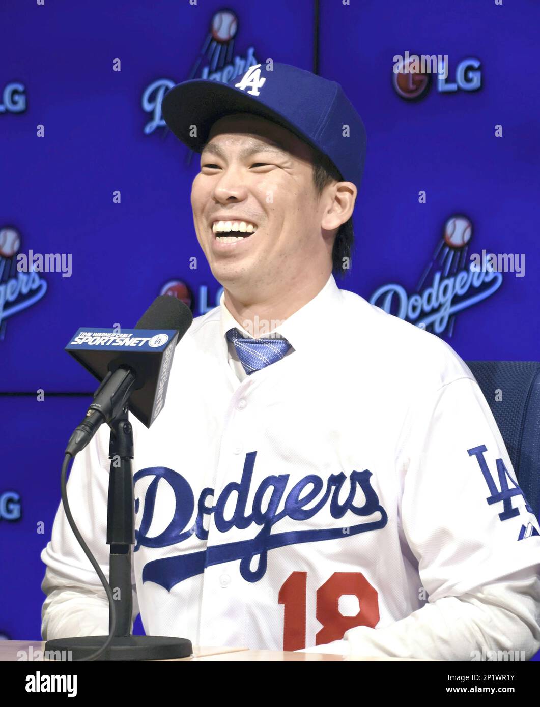 Japanese right-hand pitcher Kenta Maeda, wearing No. 18, speaks during his  introductory press conference at Dodger Stadium in Los Angenles on Jan. 7,  2016. The former Hiroshima Carp ace made the official