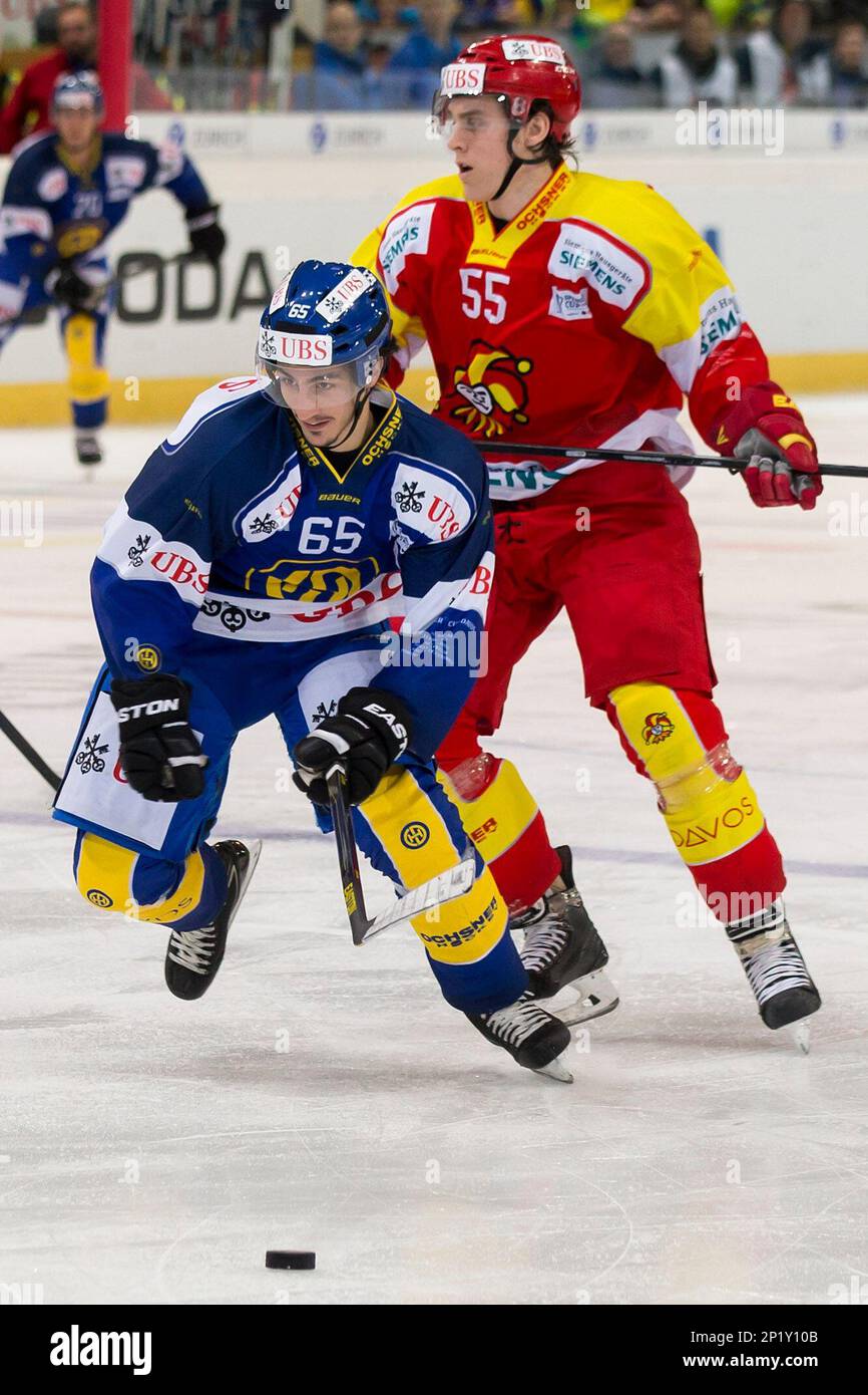 Davos Marc Wieser, left, fight for the puck with Helsinkis Atte Ohtamaa, right, during the match between Finlands Jokerit Helsinki and Switzerlands HC Davos at the 89th Spengler Cup hockey tournament in