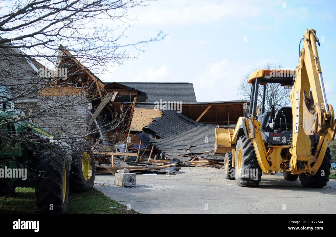 A car port of Delbert and Sharon Craft is damaged from a tornado that
