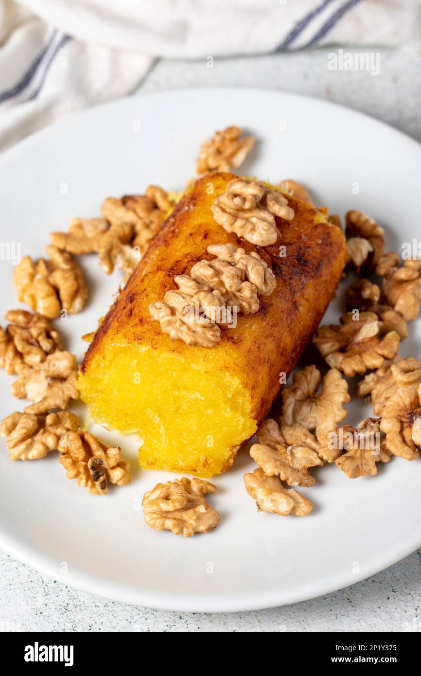 Cheese halva on gray floor. Traditional Mediterranean cuisine flavors