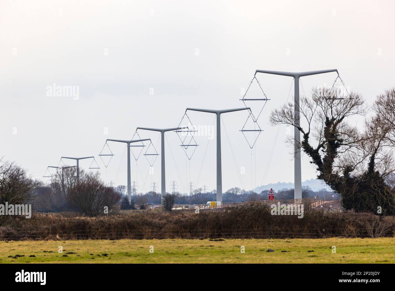 Line of T pylons under construction Stock Photo Alamy