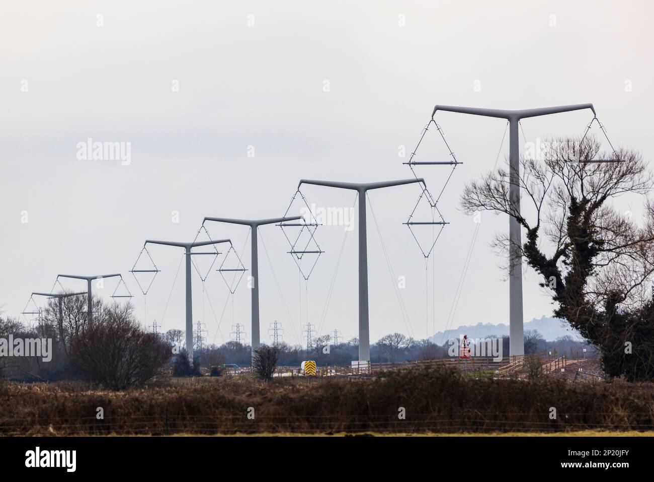 Line of T pylons under construction Stock Photo Alamy