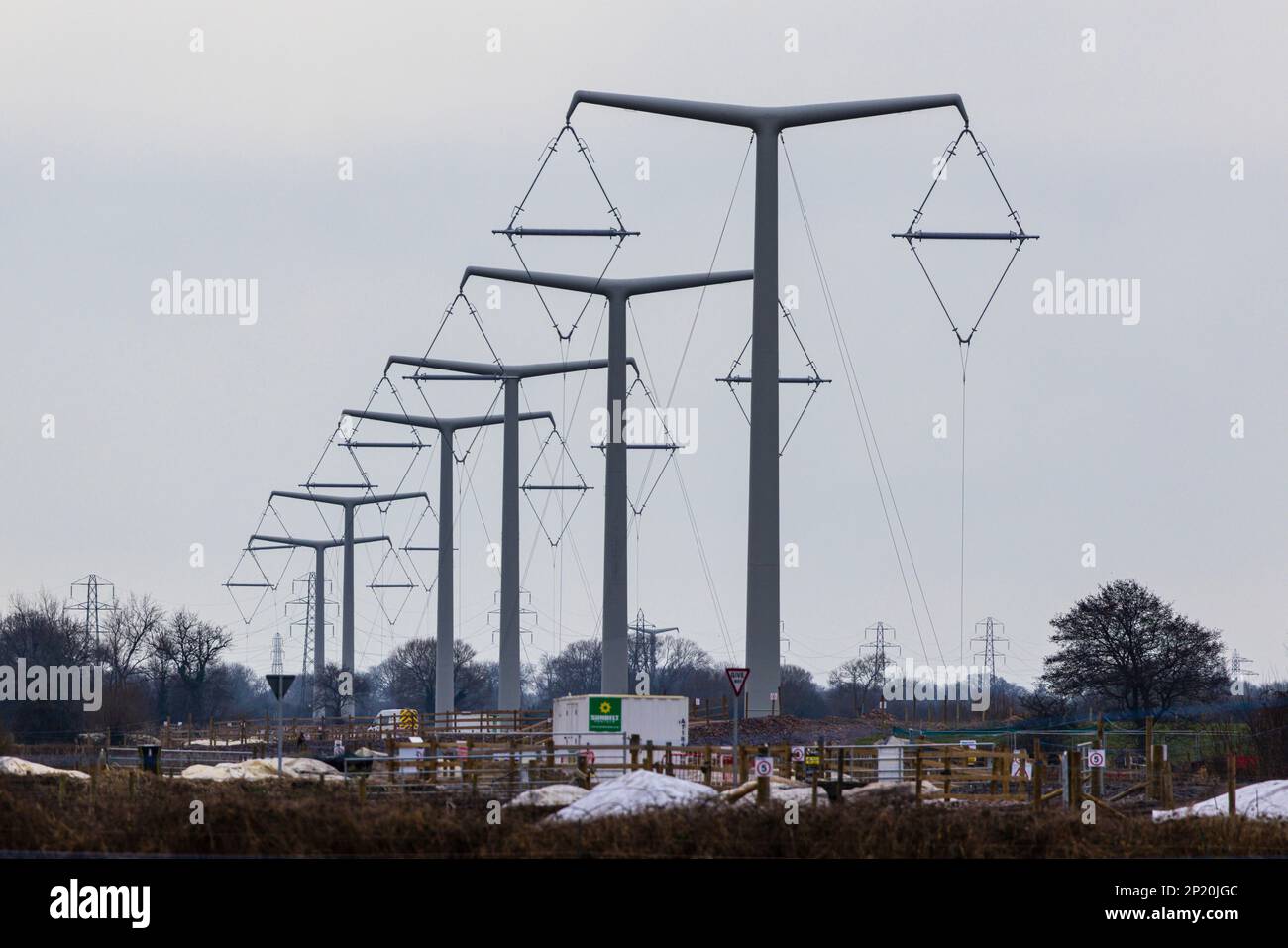 Line of T pylons under construction Stock Photo Alamy