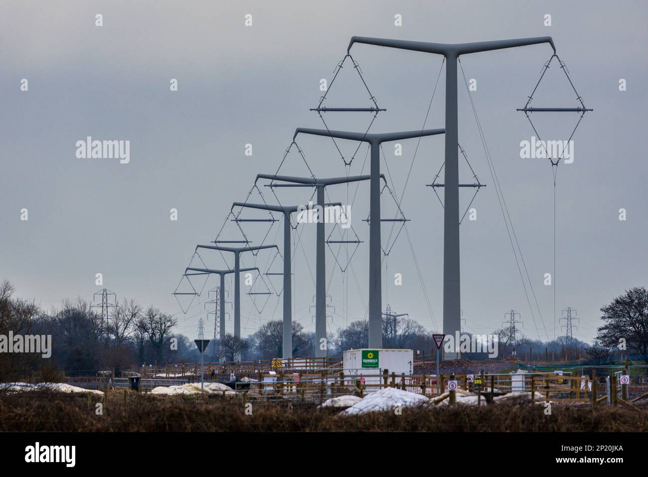 Line of T pylons under construction Stock Photo Alamy