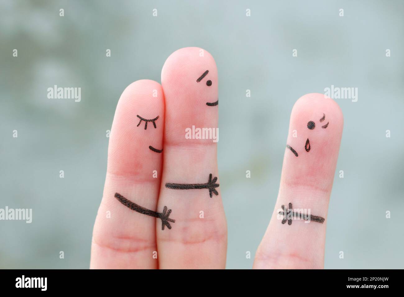 Fingers art of happy couple. A man loves another woman. The concept of unrequited love. Stock Photo