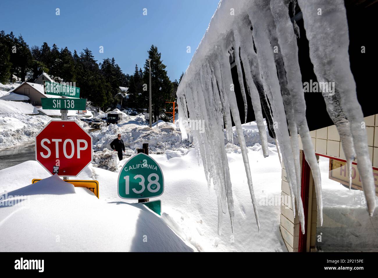 Snowfall surrounds businesses in Crestline, Calif., Friday, March 3