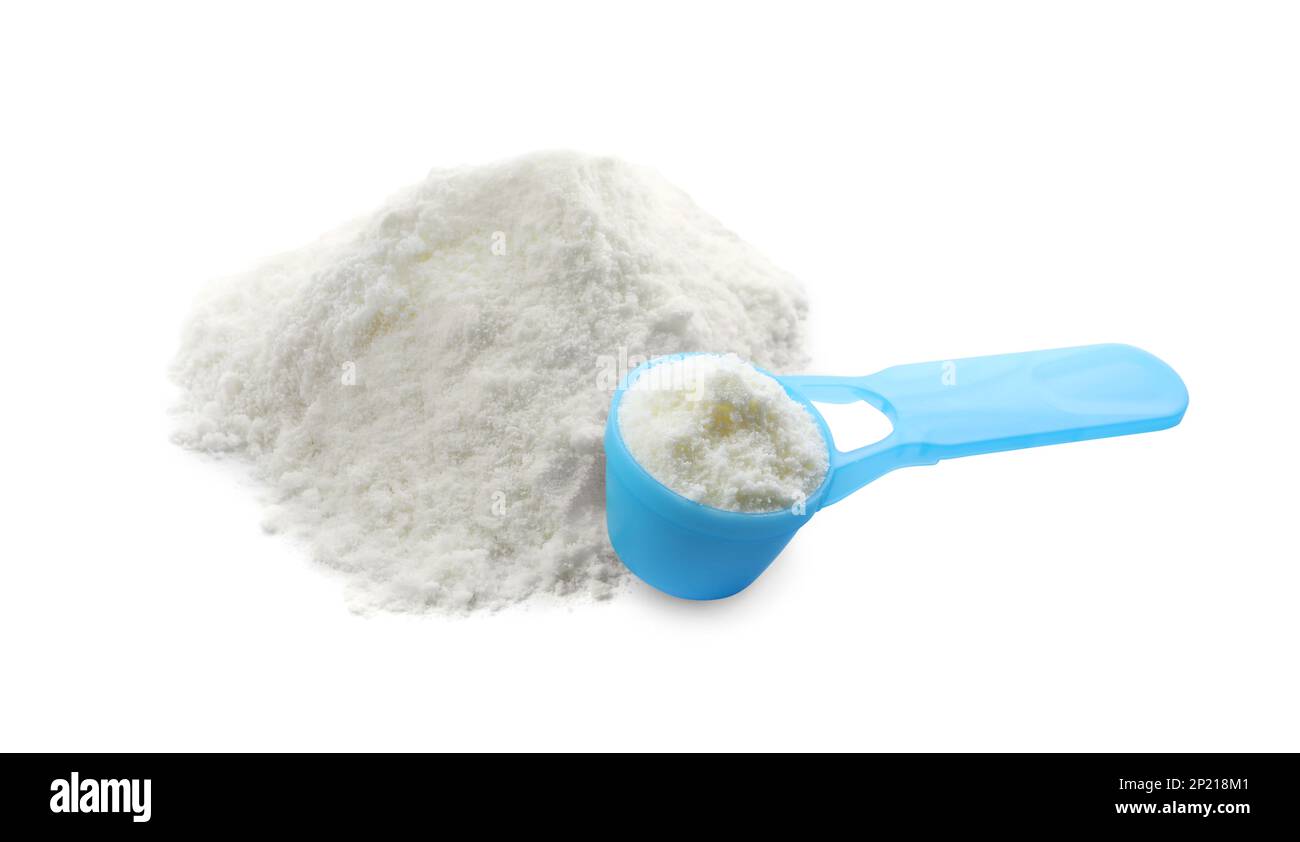 Powdered infant formula and scoop on white background. Baby milk Stock