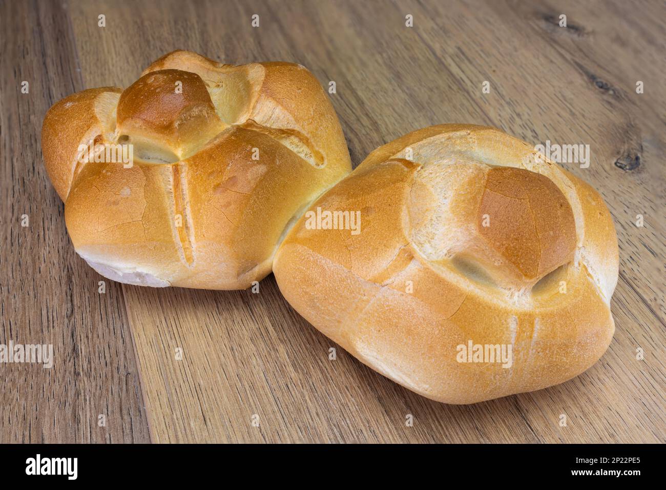 typical Milan tradition bun bread 'michetta' wooden table Stock Photo