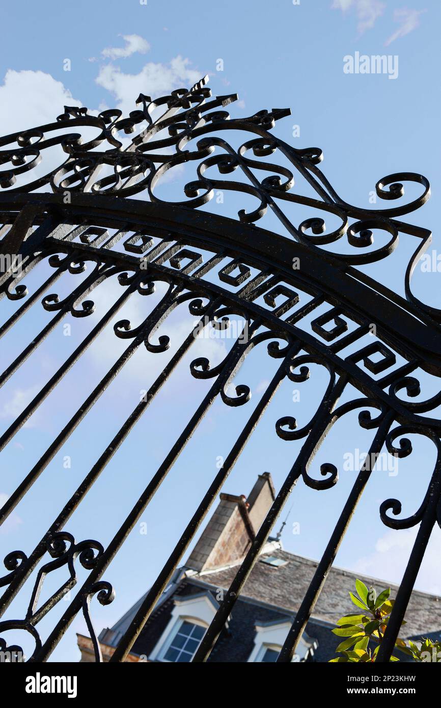 Weathered black wrought iron gate Stock Photo - Alamy