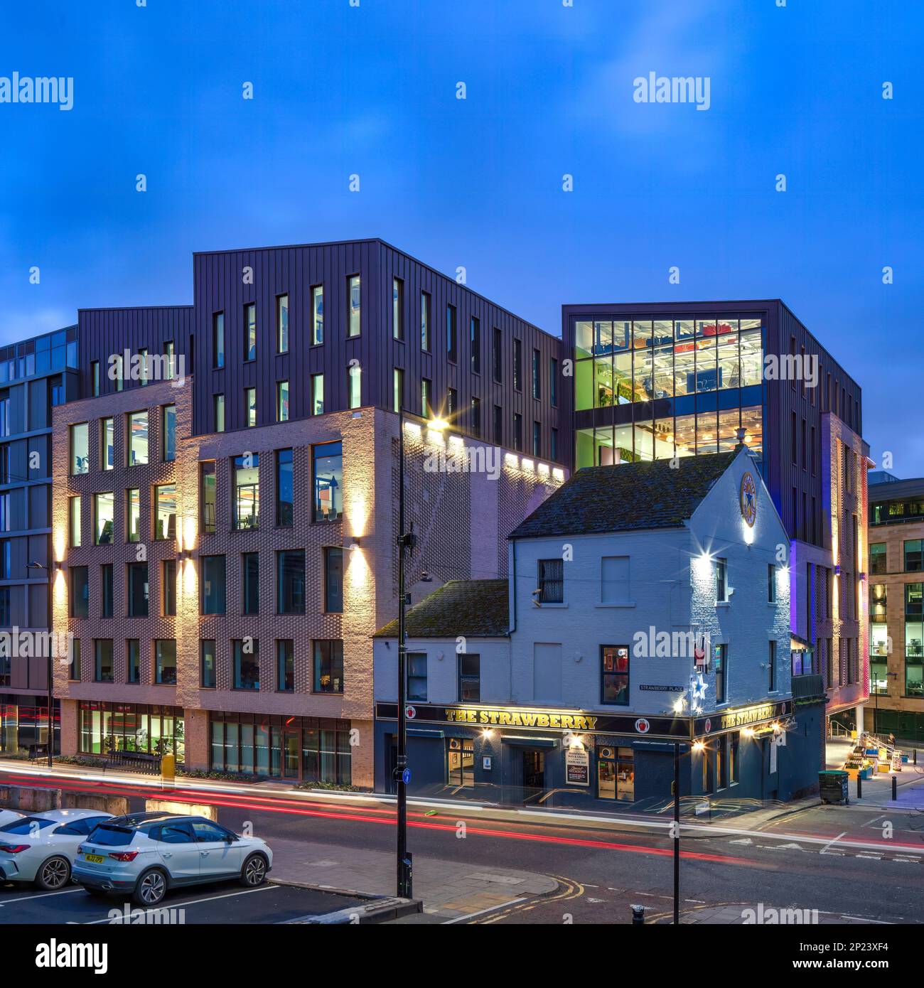 External architectural view at dusk of One Strawberry Lane, Newcastle Upon Tyne, with the building lit up inside plus external floodlighting Stock Photo