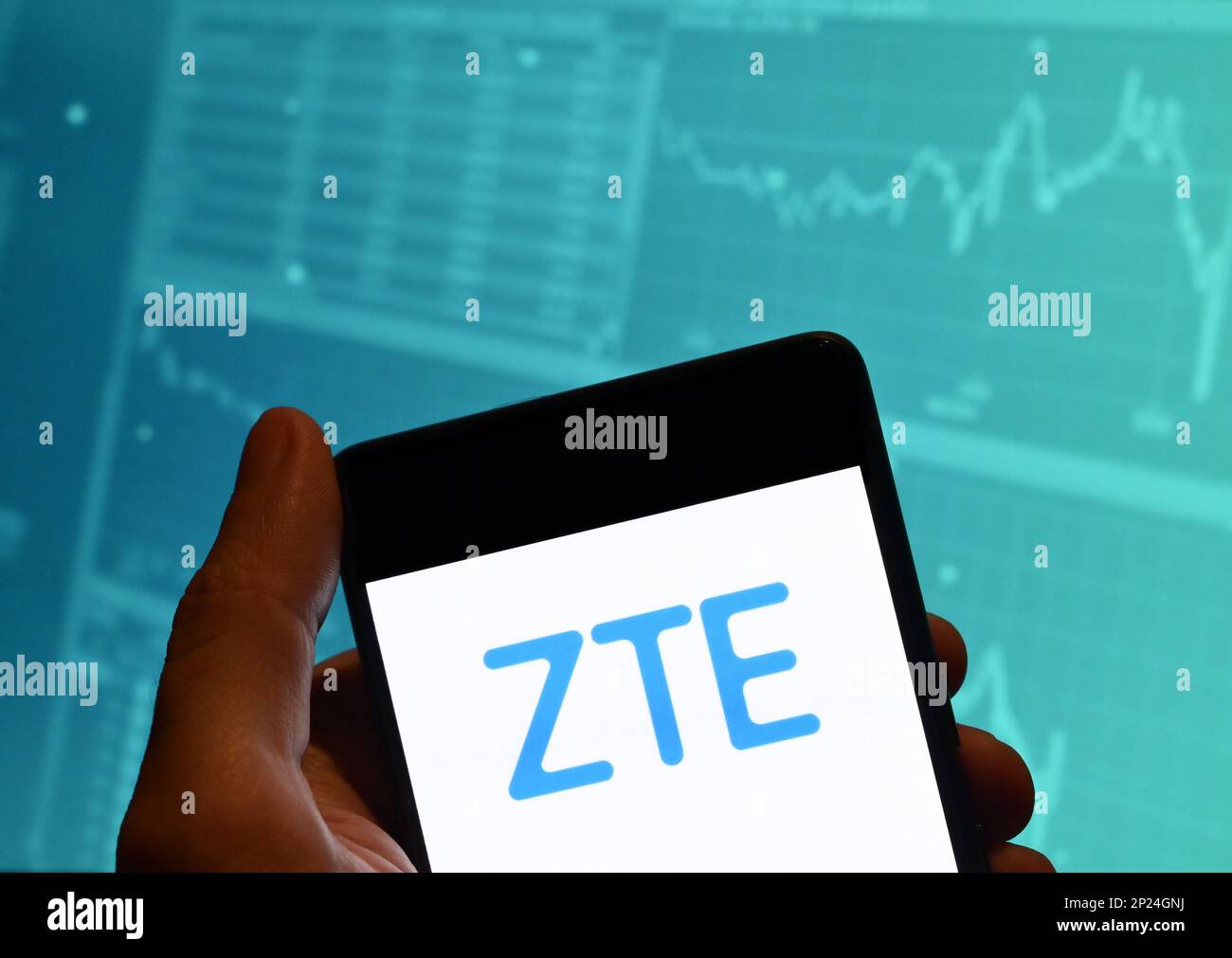 China. 19th Feb, 2023. In this photo illustration, the Chinese multinational telecommunications equipment and systems company ZTE logo is seen displayed on a smartphone with an economic stock exchange index graph in the background. Credit: SOPA Images Limited/Alamy Live News Stock Photo