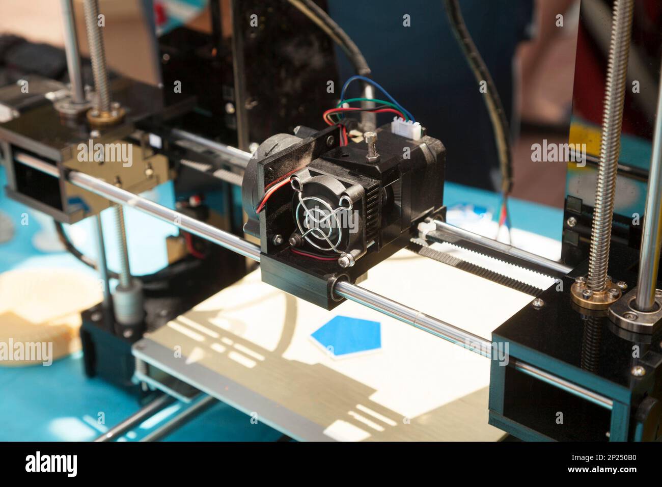 3d printer creating a new plastic object close-up. 3 dimensional printing process on innovative electronic equipment Stock Photo