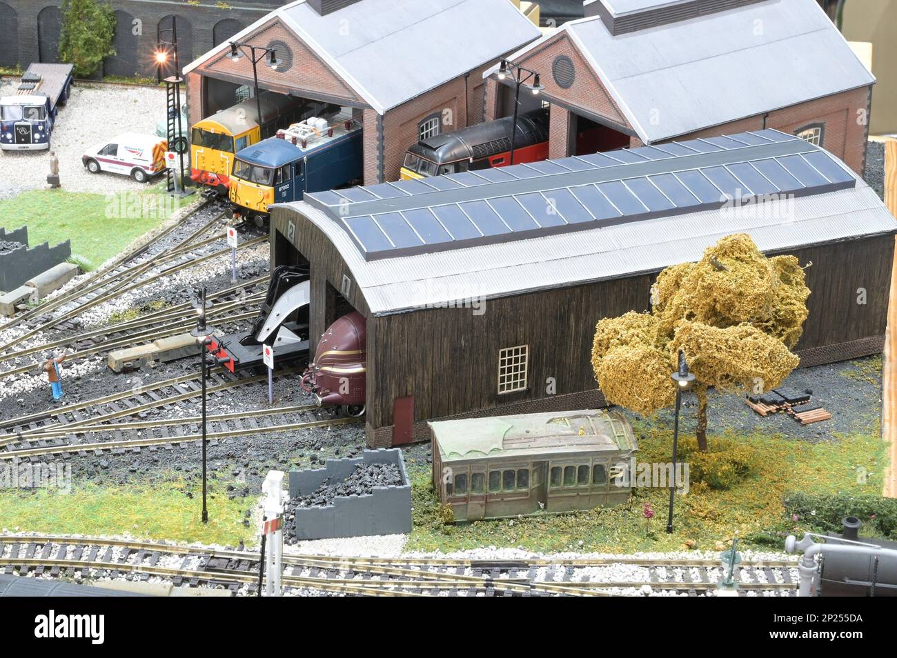 Engine sheds on a model railway in a maintenance yard. Stock Photo