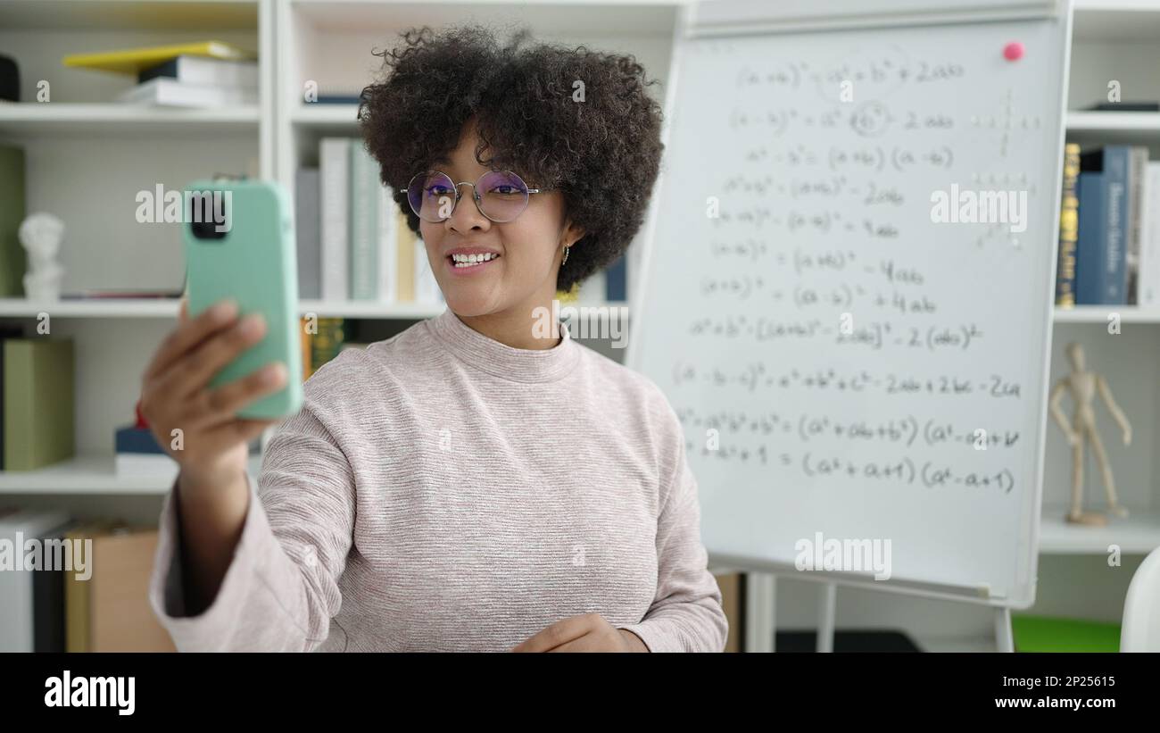 Young african american woman teacher teaching online maths lesson at