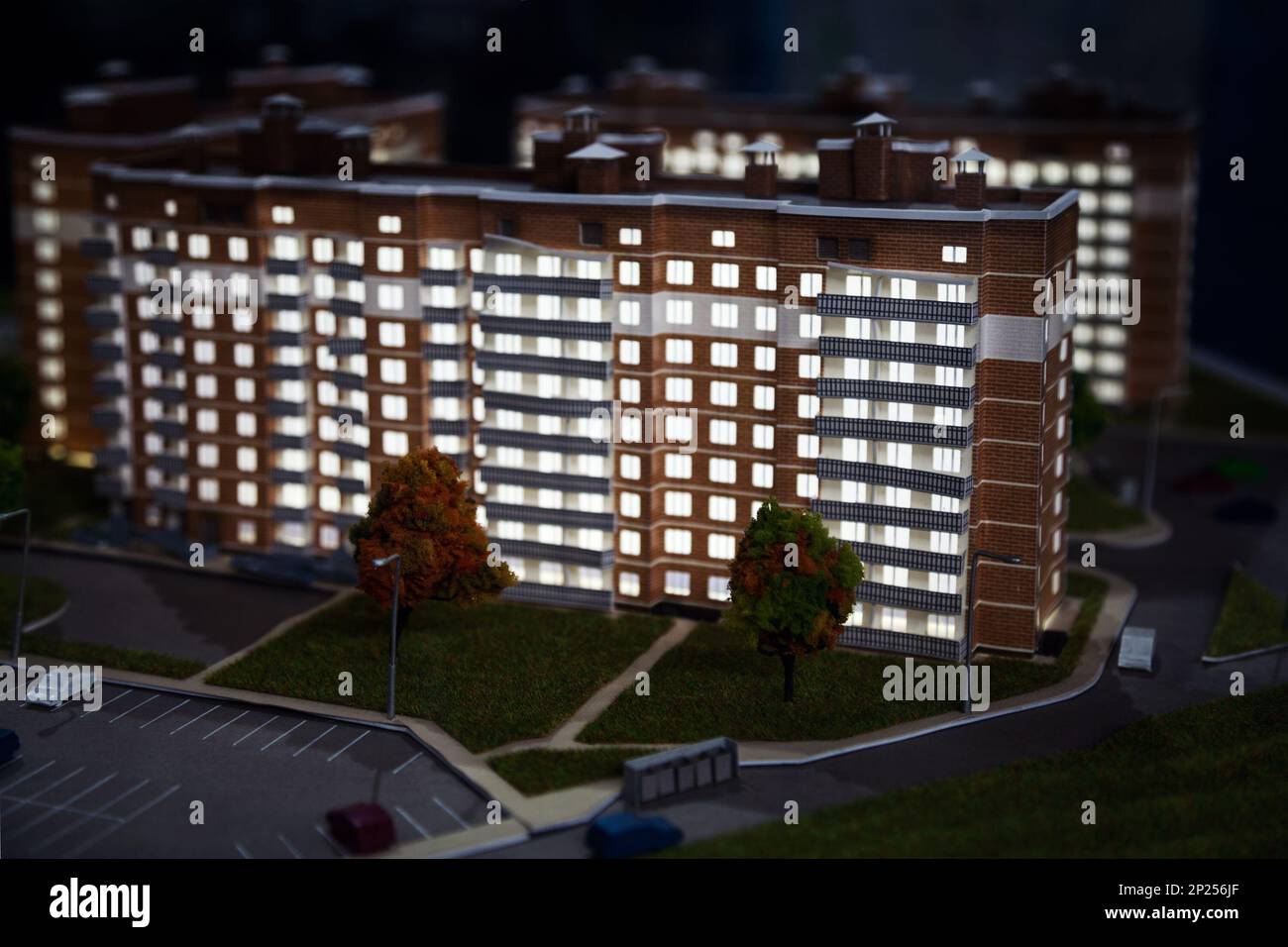 Apartment building project design. Group of miniature house models in