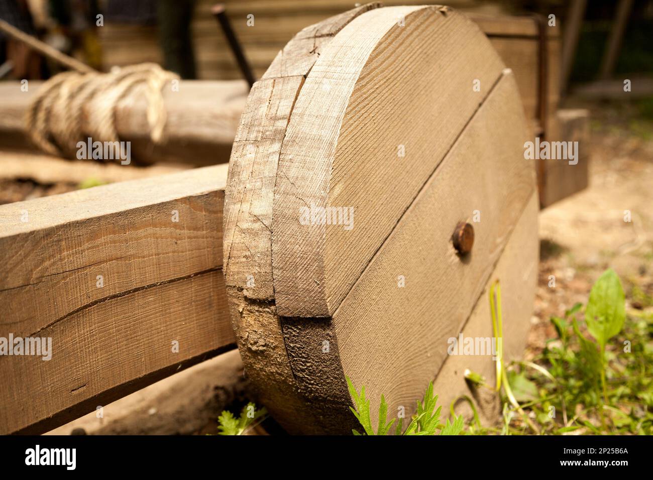 Historical wooden catapult wheel. Trebuchet medieval weapon close-up Stock Photo