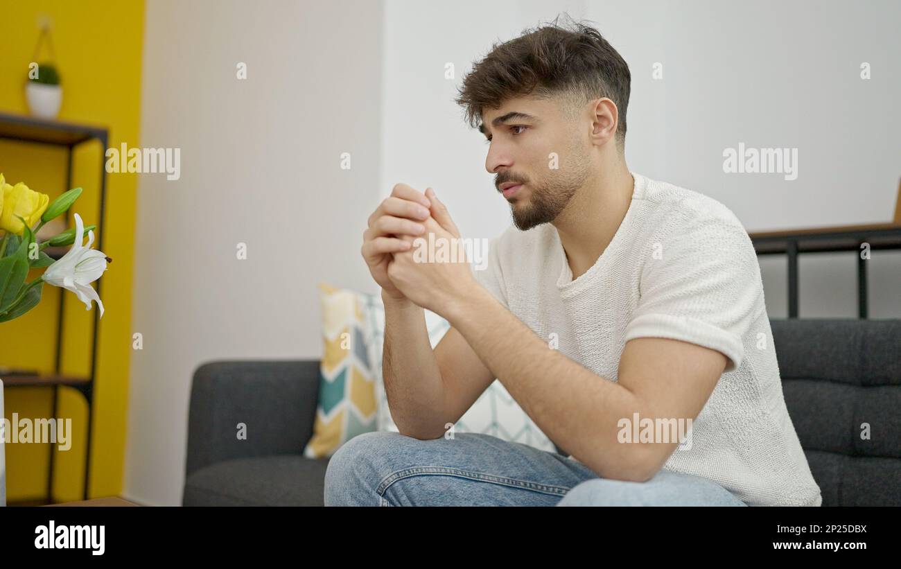 Arab man sitting on sofa hi-res stock photography and images - Alamy