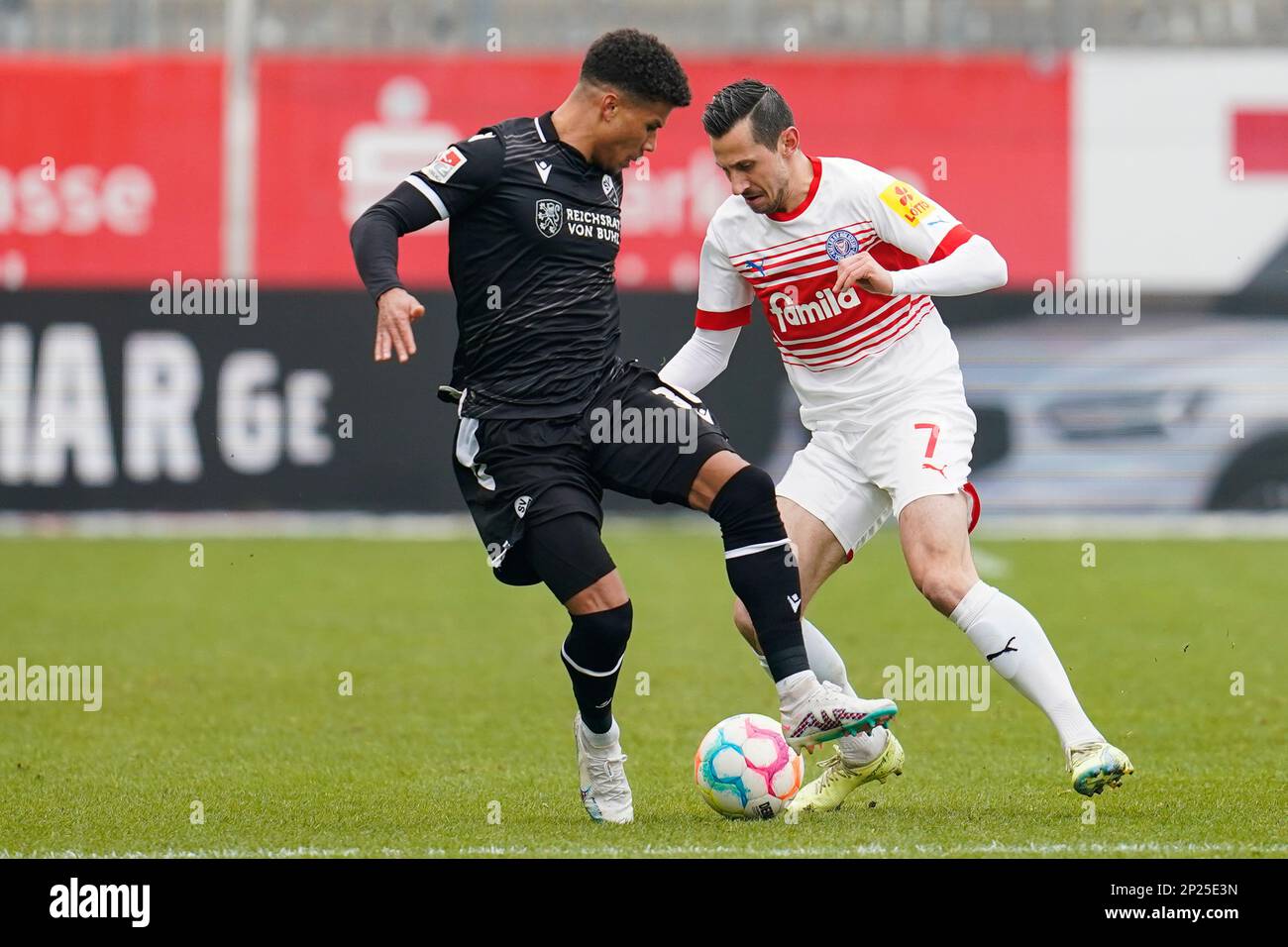 Germany. 04th Mar, 2023. Sandhausen, Germany. 04th Mar, 2023. Soccer: 2nd Bundesliga, SV Sandhausen - Holstein Kiel, Matchday 23, BWT-Stadion am Hardtwald. Sandhausen's Chima Okoroji (l) and Kiel's Steven Skrzybski fight for the ball. Credit: Uwe Anspach/dpa - IMPORTANT NOTE: In accordance with the requirements of the DFL Deutsche Fußball Liga and the DFB Deutscher Fußball-Bund, it is prohibited to use or have used photographs taken in the stadium and/or of the match in the form of sequence pictures and/or video-like photo series./dpa/Alamy Live News Credit: dpa picture alliance/Alamy Live New Stock Photo