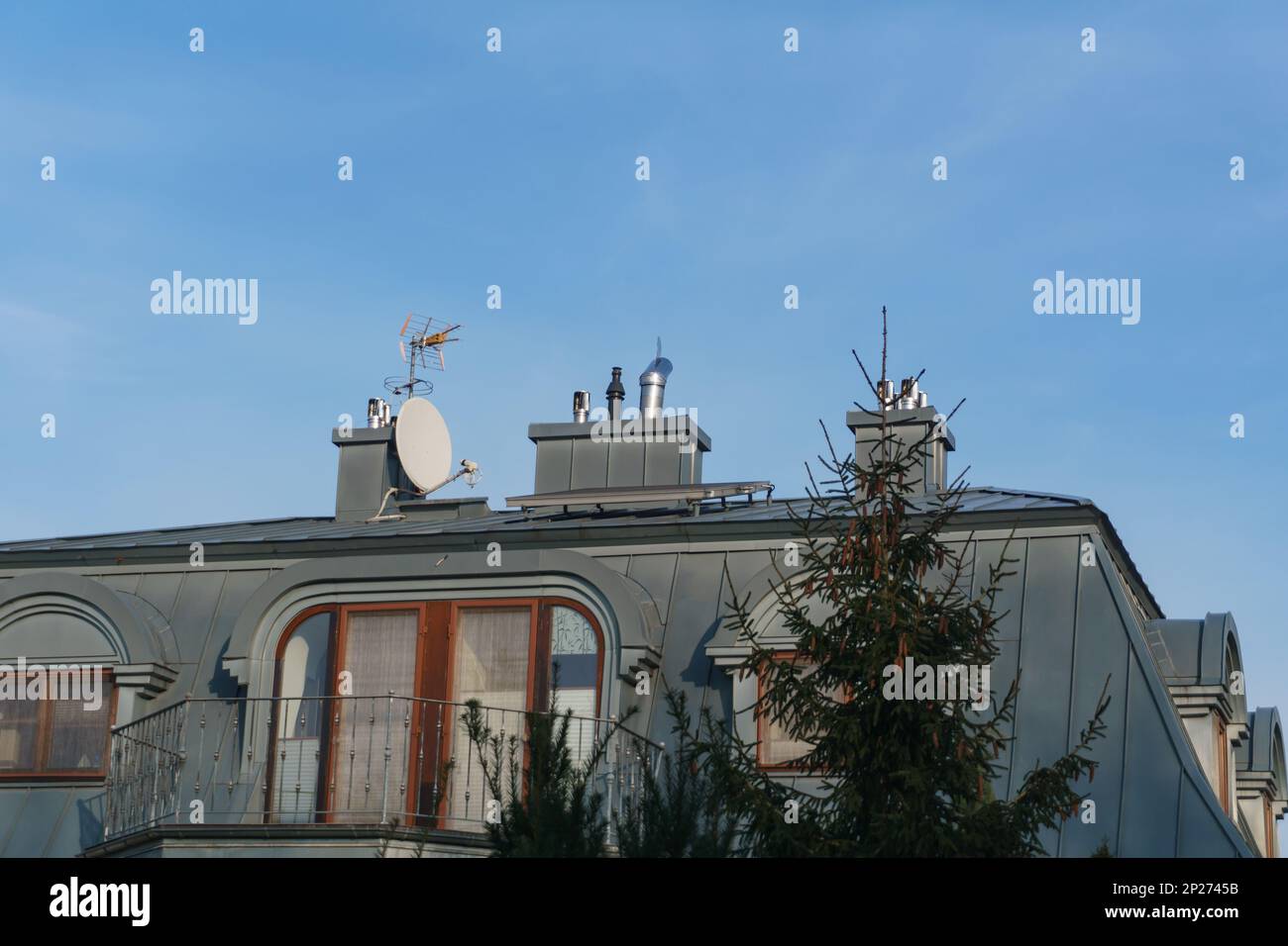 a metal rooftop of a house with antennas Stock Photo Alamy