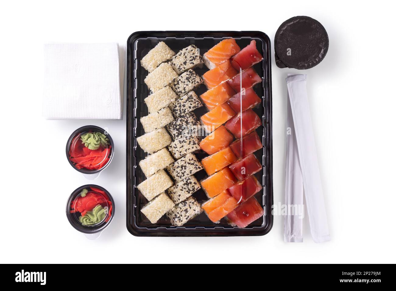 Sushi set with wasabi, ginger and soy sauce served in plastic box takeaway, to go. Assorted of