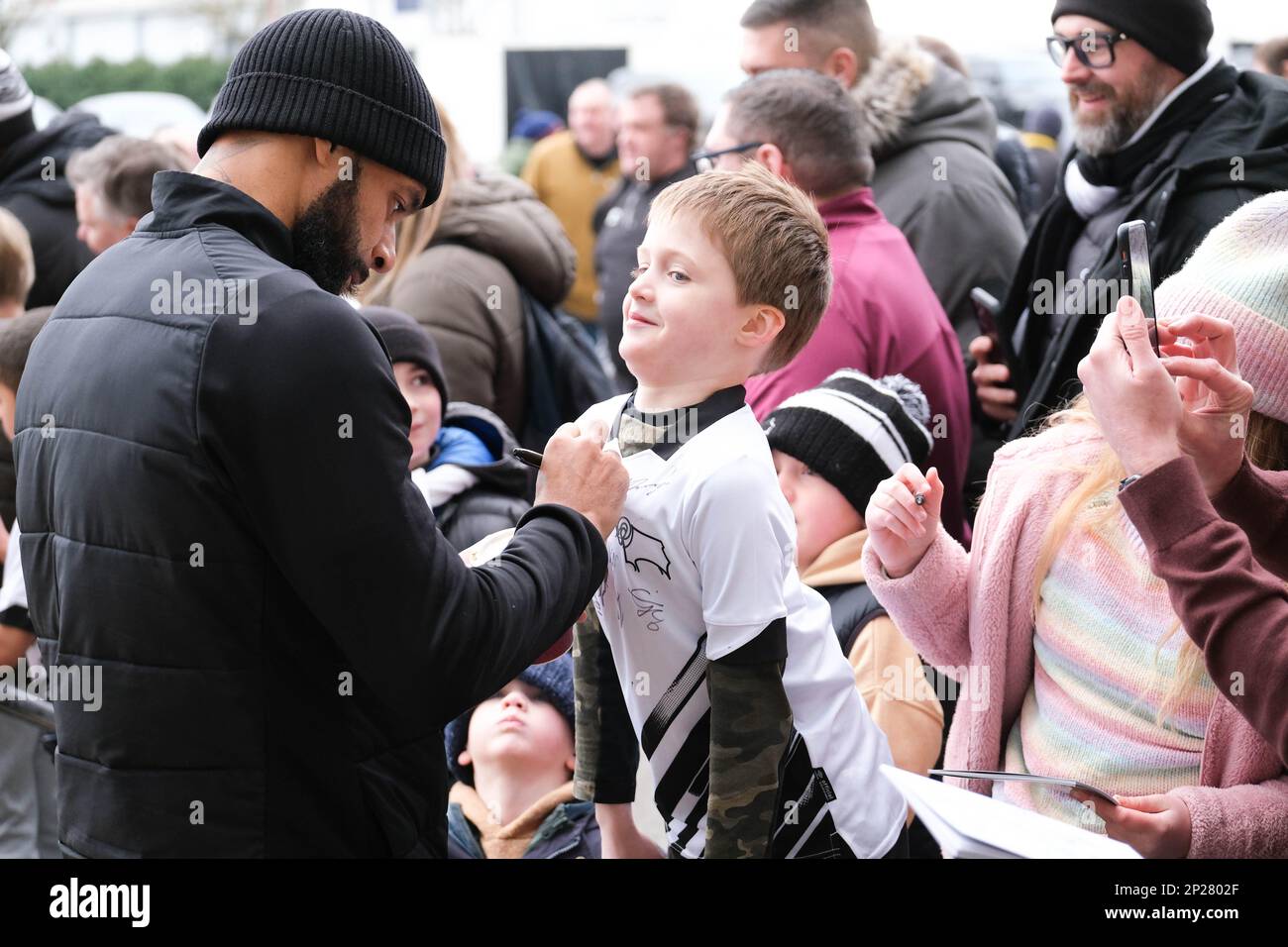 Pride Park, Derby, Derbyshire, UK. 4th Mar, 2023. League One Football, Derby County versus Shrewsbury Town; David McGoldrick of Derby County signing a young fans shirt before kick off Credit: Action Plus Sports/Alamy Live News Stock Photo