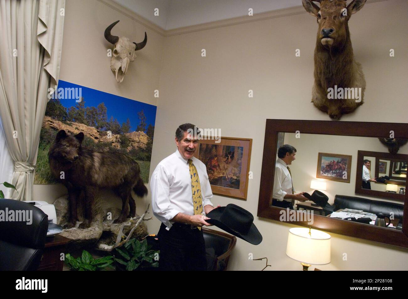 Rep. Denny Rehberg, R-Mont., talks about a cowboy hat on display in his