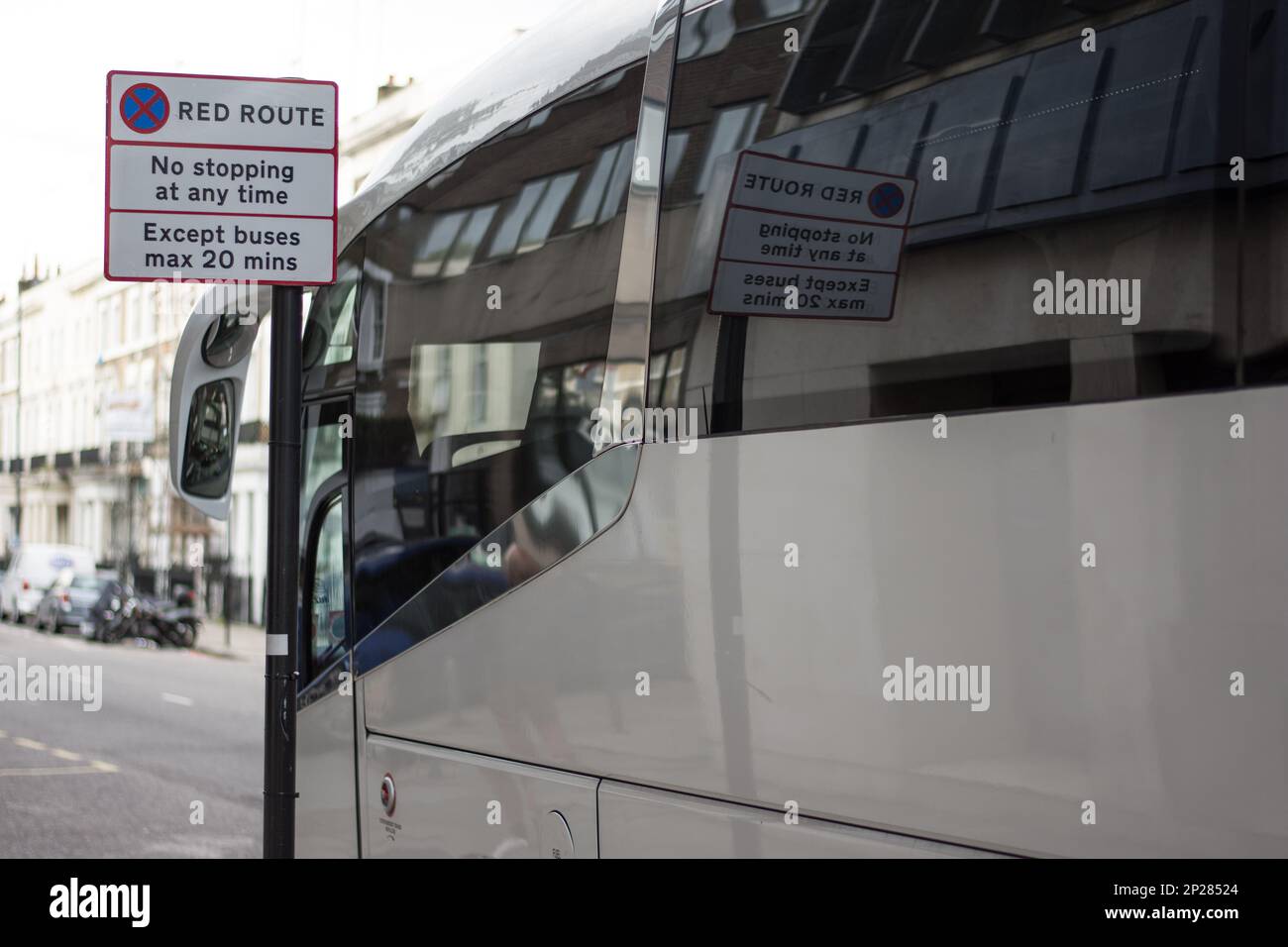 A street sign in London alerts drivers they are driving on a red route