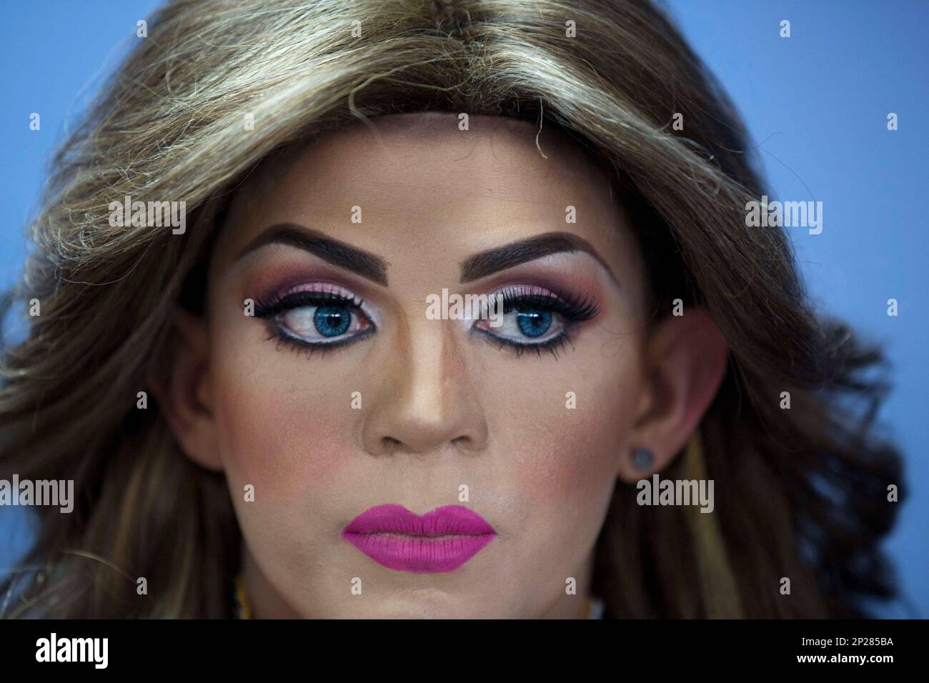 In this Oct. 18, 2015 photo, contestant Jorge Solano, Miss Gay Cojedes,  waits backstage, ready to compete in the Miss Gay Venezuela beauty pageant  in Caracas, Venezuela. At the ninth annual competition,
