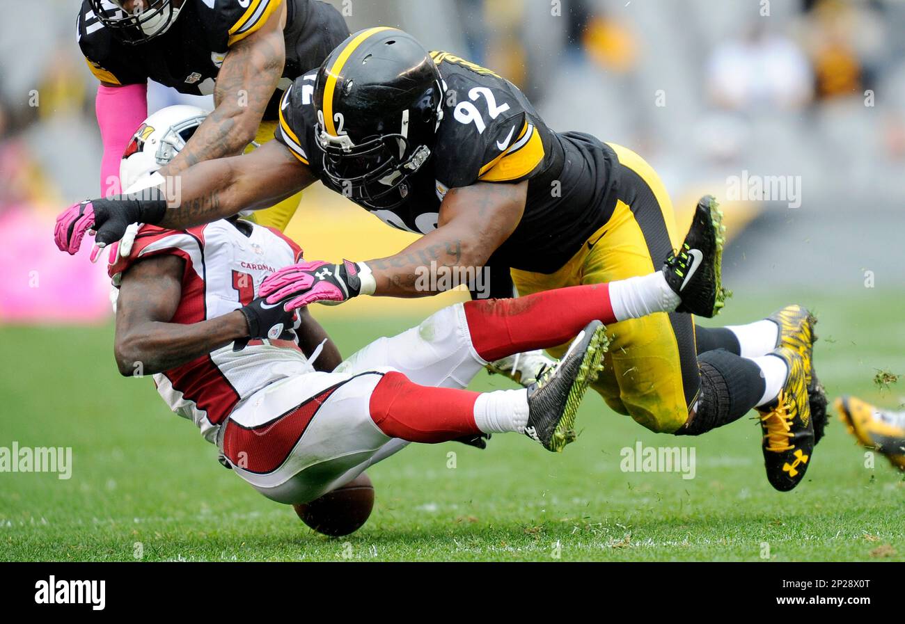 Arizona Cardinals wide receiver John Brown 12 fumbles after being hit by Pittsburgh Steelers outside linebacker James Harrison 92 in the third quarter an NFL football game Sunday Oct. 18 2015 in