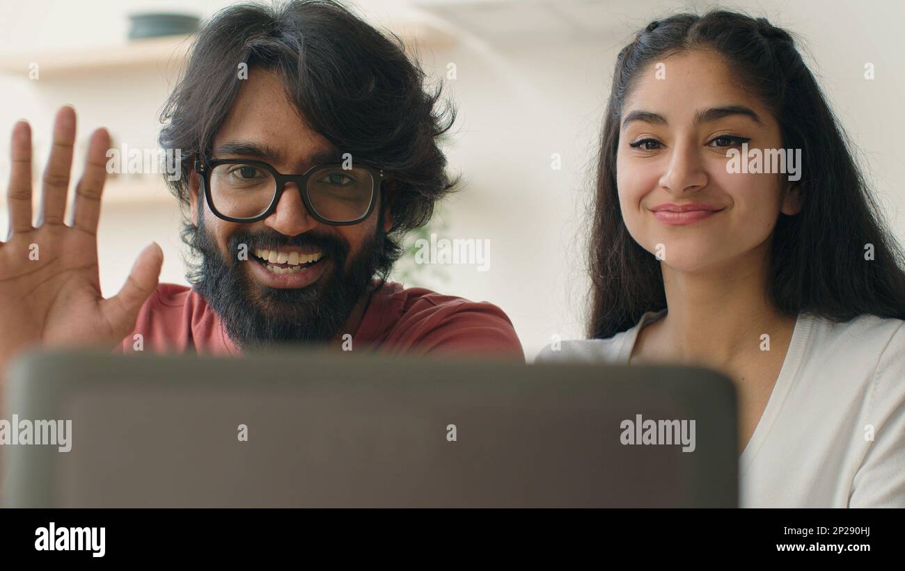 Multiracial man and woman talking in computer web chat saying hello greet  friends at webcam video call married ethnic diverse couple chatting online  Stock Photo - Alamy