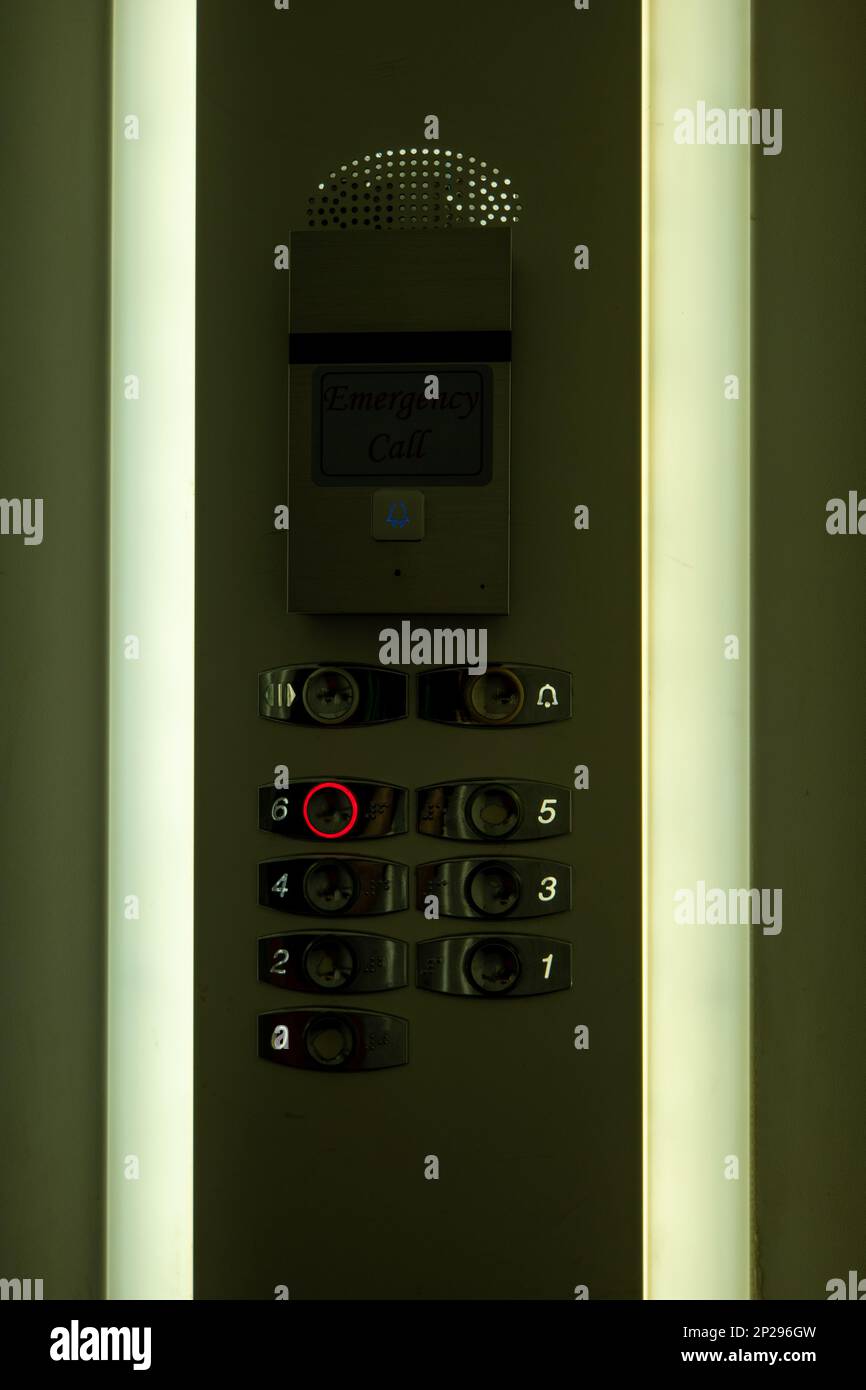 Stainless Steel Elevator Interface with Screen That Reads "Emergency
