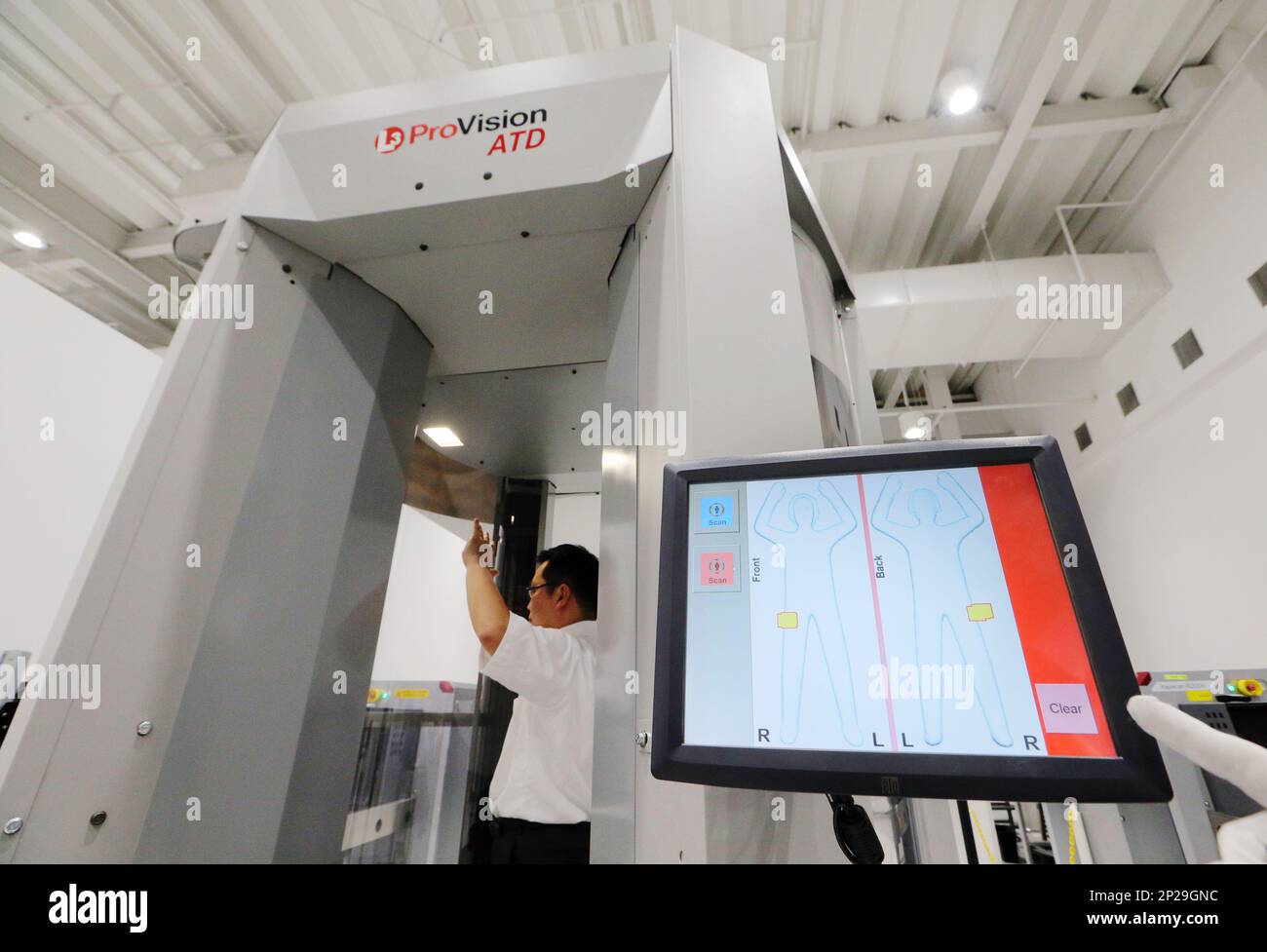 A “full-body scanner” is shown to media on at Terminal 2 of Kansai Airport  before trial operations begin in izumi-Sano, Osaka Prefecture on Oct. 14,  2015. Full-body scanners use radio waves to