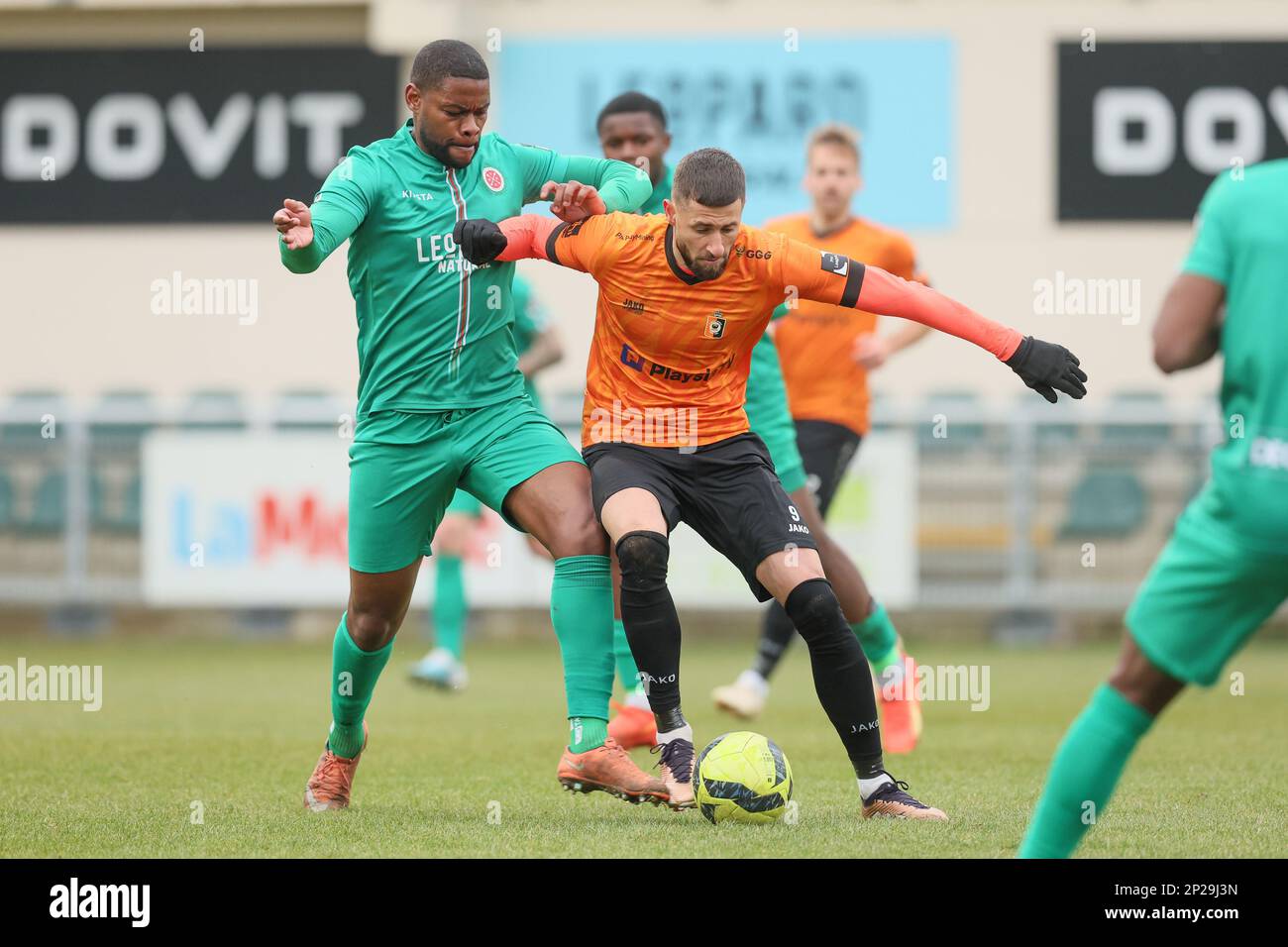 Virton's William Remy and Deinze's Dylan De Belder fight for the ball during a soccer match between RE Virton and KMSK Deinze, Saturday 04 March 2023 in Virton, on day 2 of Relegation Play-offs of the 2022-2023 'Challenger Pro League' 1B second division of the Belgian championship. BELGA PHOTO BRUNO FAHY Stock Photo