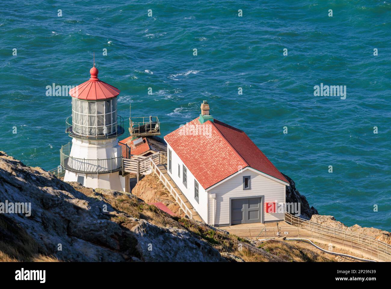 Historic lighthouse on rocky outcrop in Point Reyes National Seashore ...