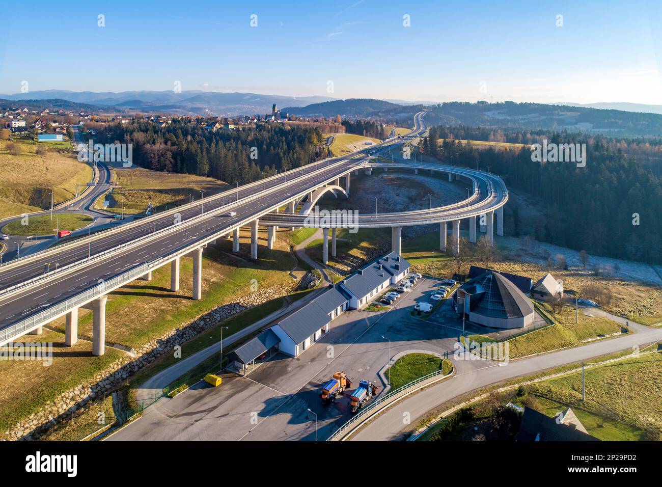 New highway in Poland on national road no 7, E77, called Zakopianka.  Overpass junction with a traffic circle, viaducts, slip roads and cars. Skomieln Stock Photo