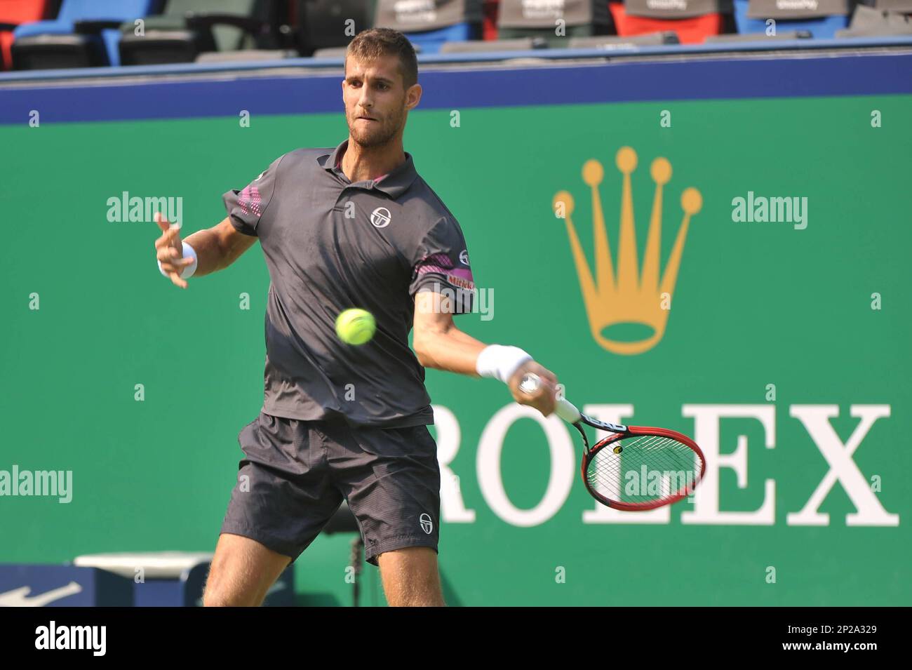 Martin Klizan of Slovakia returns a shot to Zhang Ze of China in their  first round match of the men's singles during the 2015 Shanghai Rolex  Masters tennis tournament in Shanghai, China,